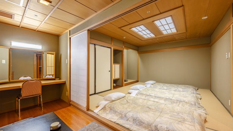 A spacious 59-square-meter Japanese-style room perfect for families to relax on tatami mats with futons 2